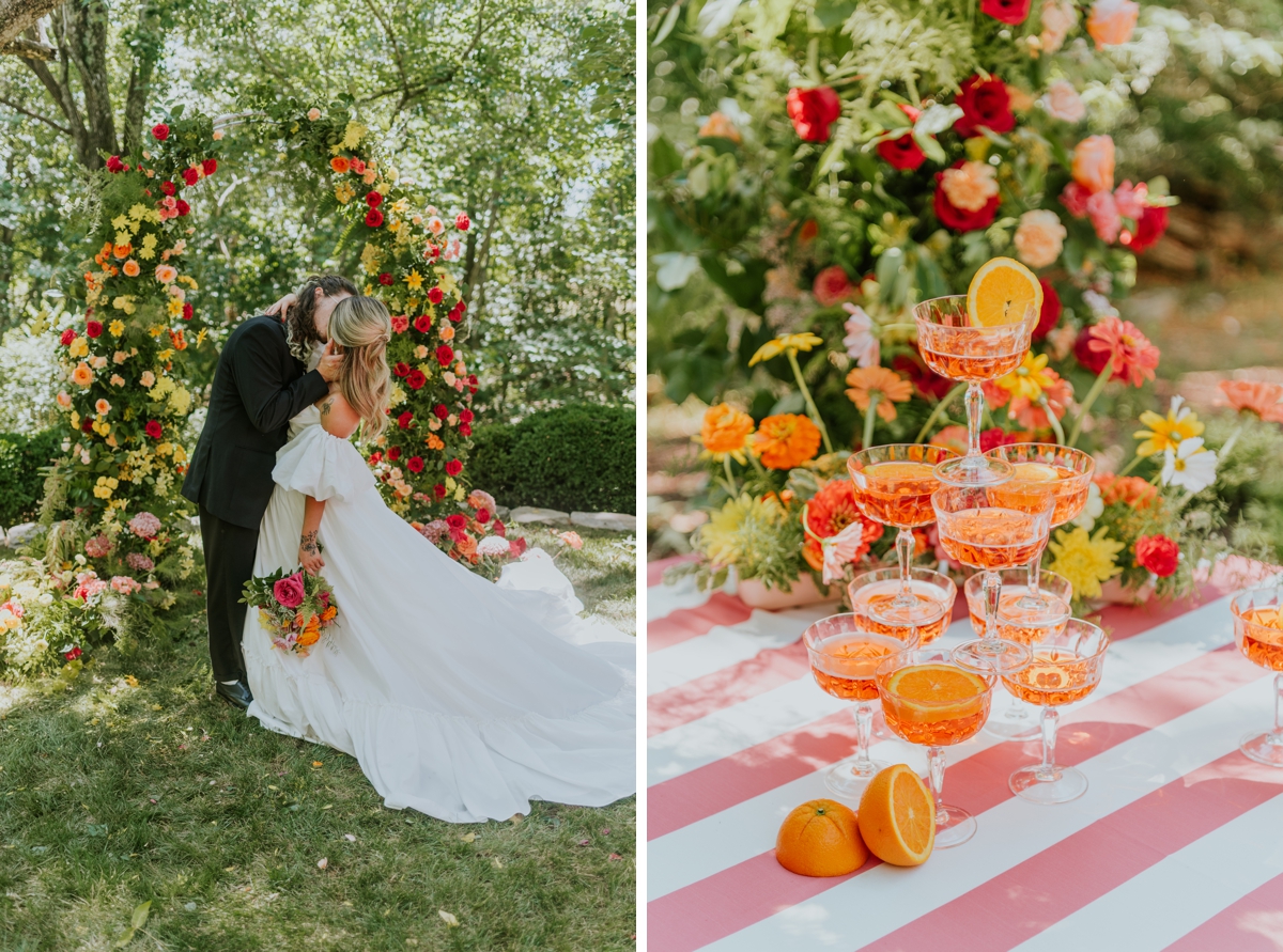 Champagne tower with fresh orange slices on a pink and white striped tablecloth