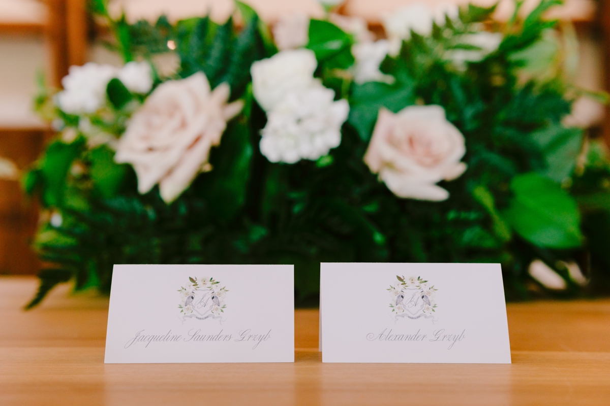 Place cards with a custom wedding crest by Turnage and Watts