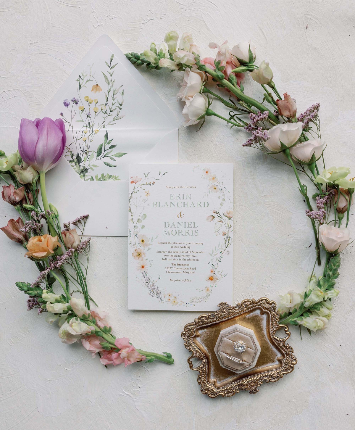 Flatlay of the Watercolor Wildflower Wedding Invitation Suite by Turnage and Watts