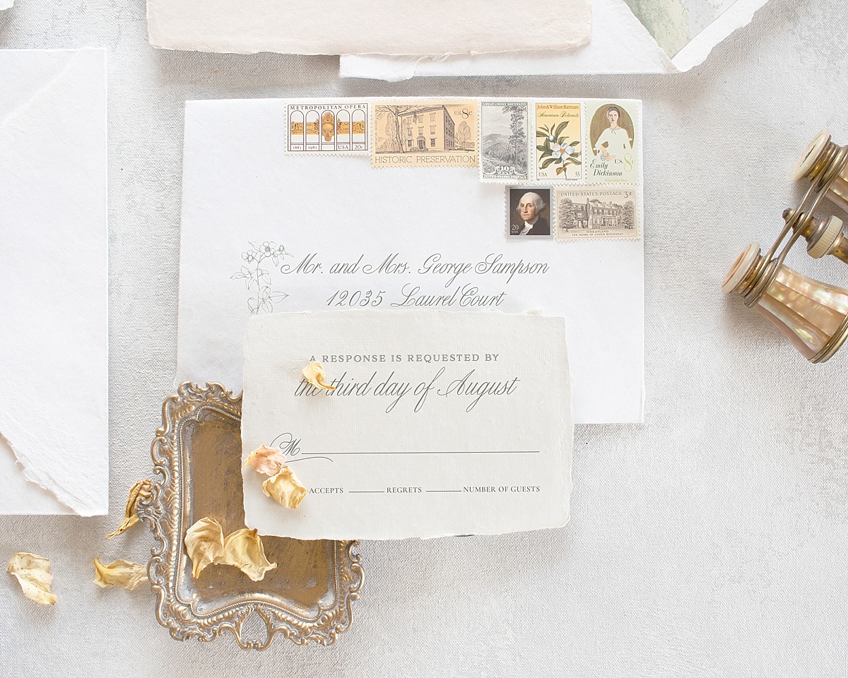 Wedding envelope and RSVP card with vintage stamps