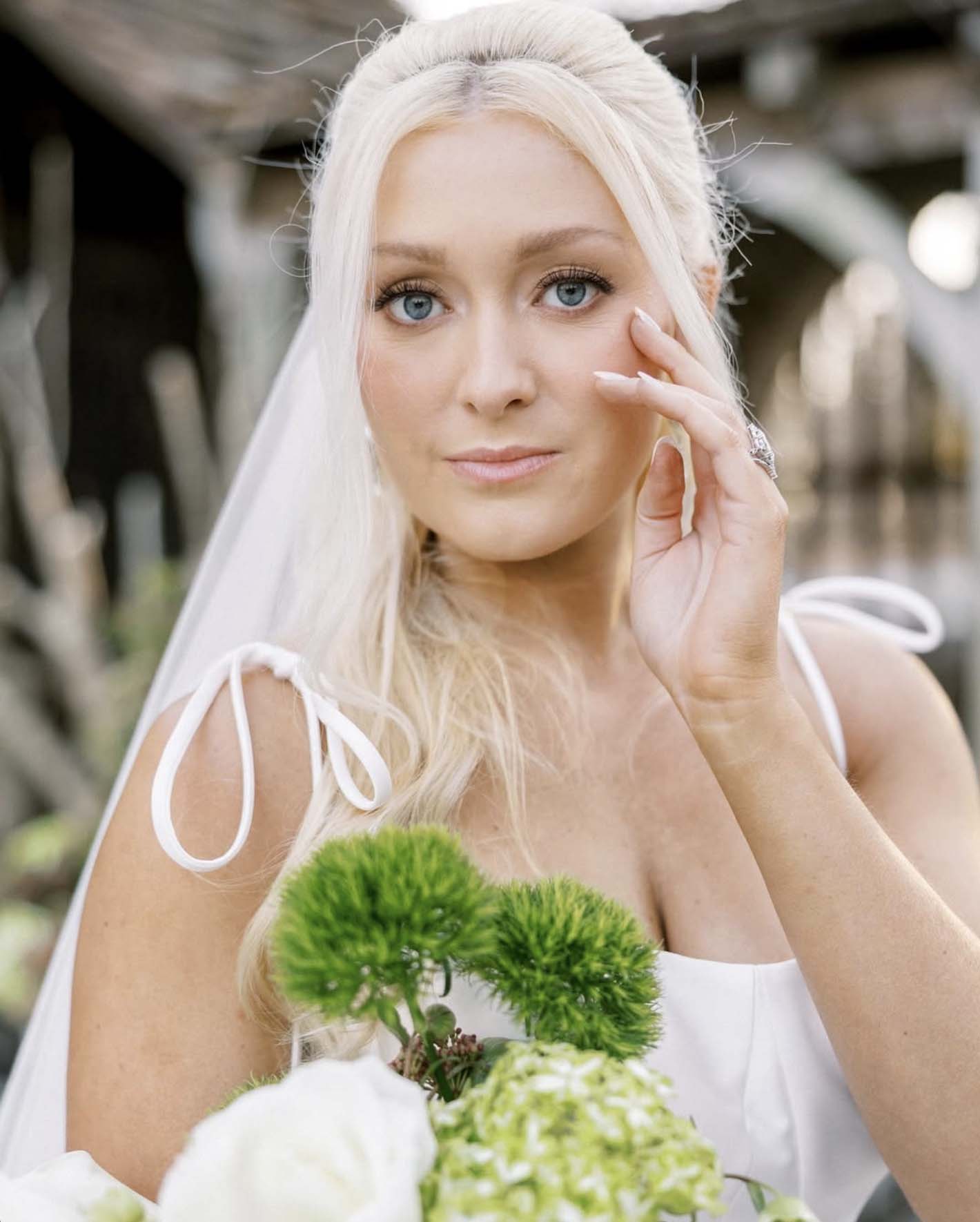 bride-holding-white-green-bouquet-cloisters-castle-wedding
