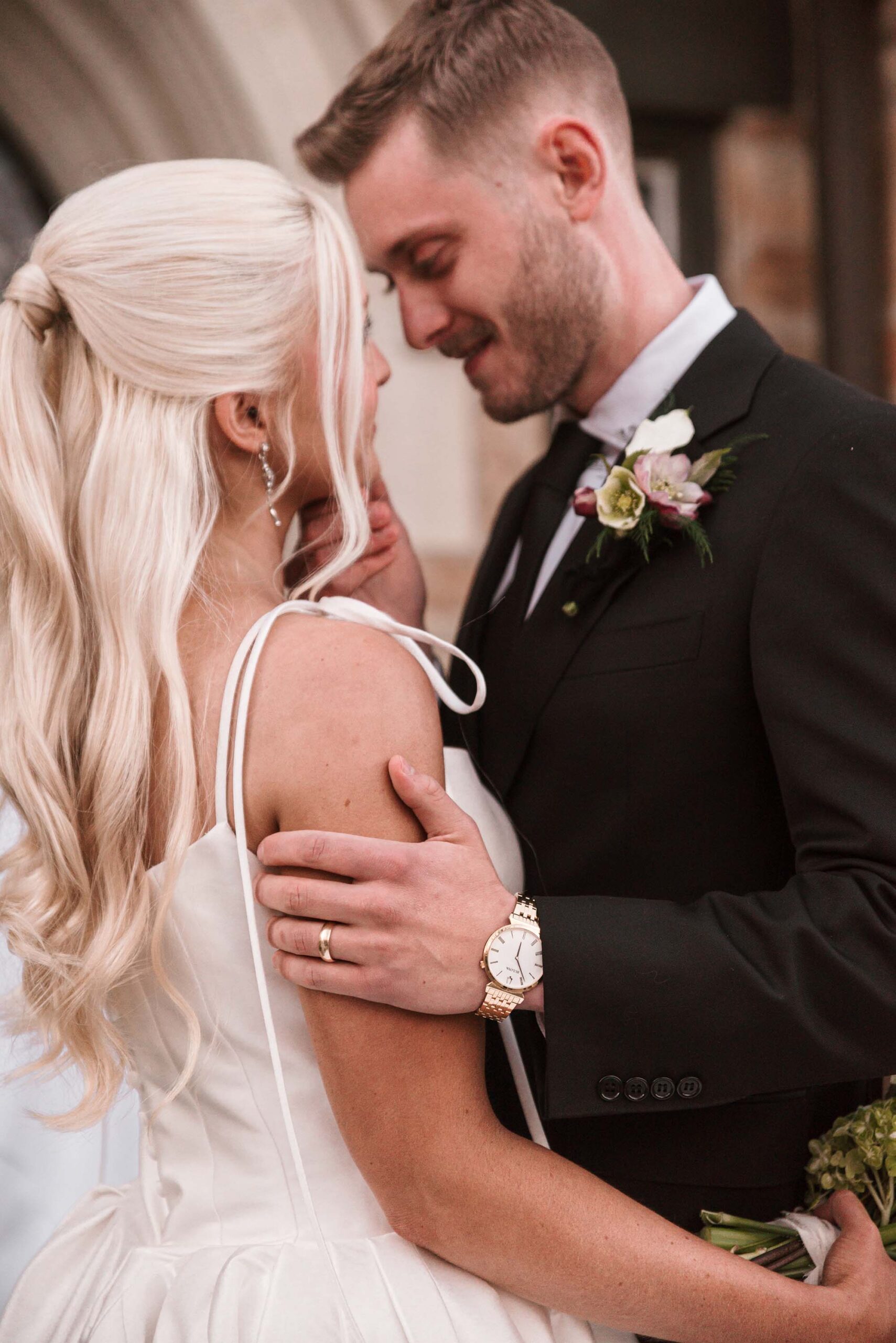 Close-up of bride and groom sharing an intimate moment during their castle wedding