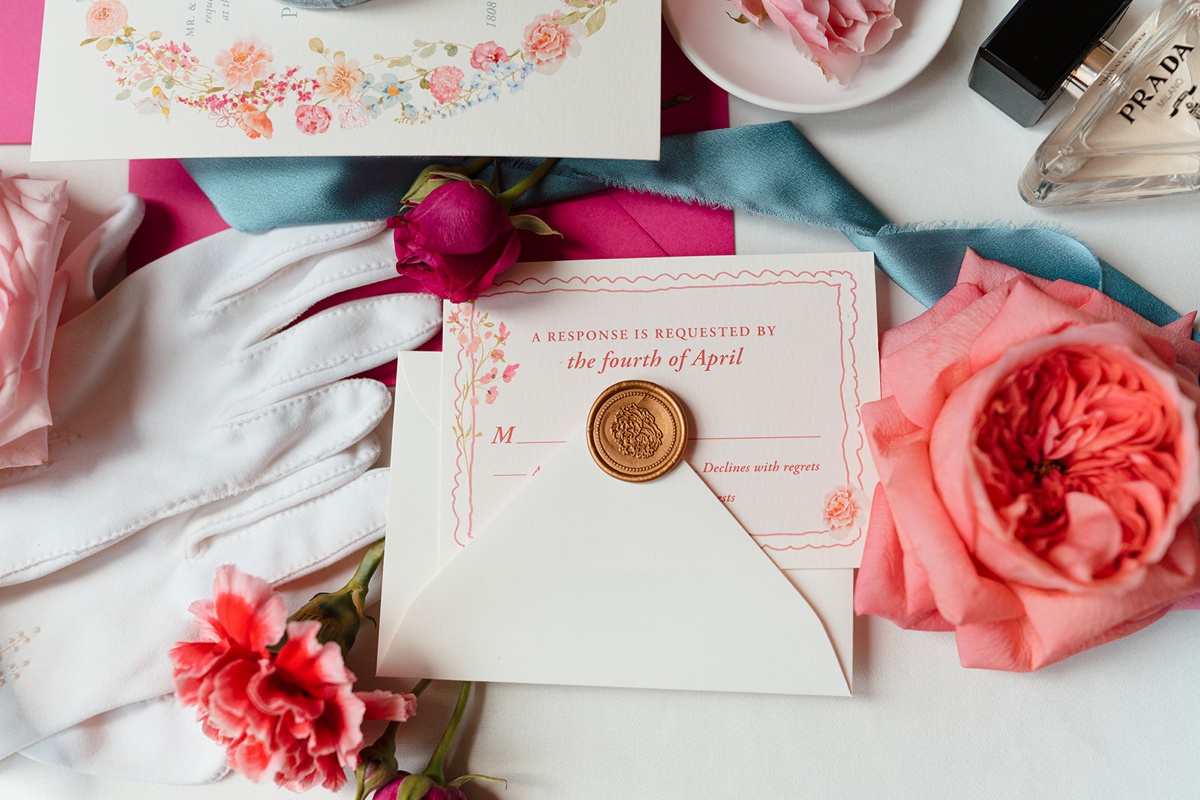 RSVP card and envelope with a gold wax seal